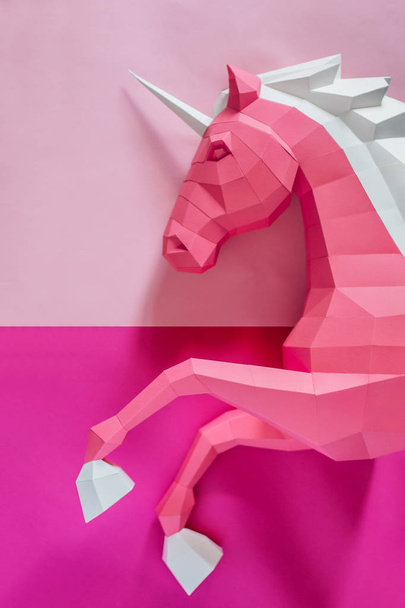 Paper unicorn head on a colored background. Geometry, bright and pastel colors. - Фото, изображение