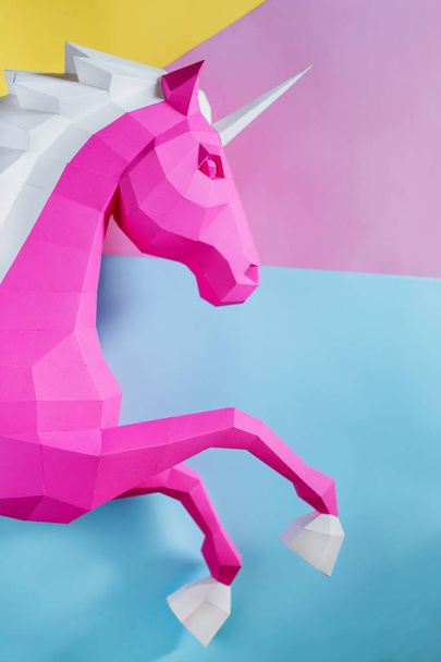 Paper unicorn head on a colored background. Geometry, bright and pastel colors. - Fotó, kép