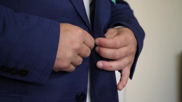 Businessman man buttons up his hands on his jacket in morning going to work. oncept of business employee. Dress code. Close-up - Footage, Video
