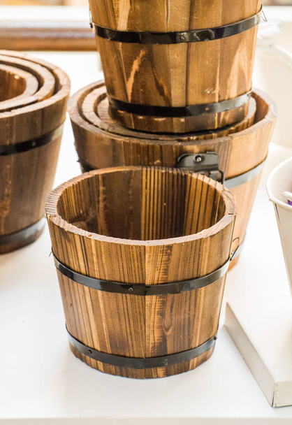 Set of buckets made of wood in a market place - Photo, Image