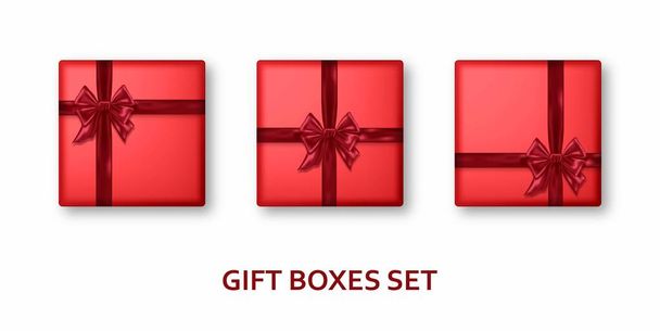 Cajas de regalo rojas con cintas y lazos. Realista presenta aislado sobre fondo blanco
 - Vector, Imagen