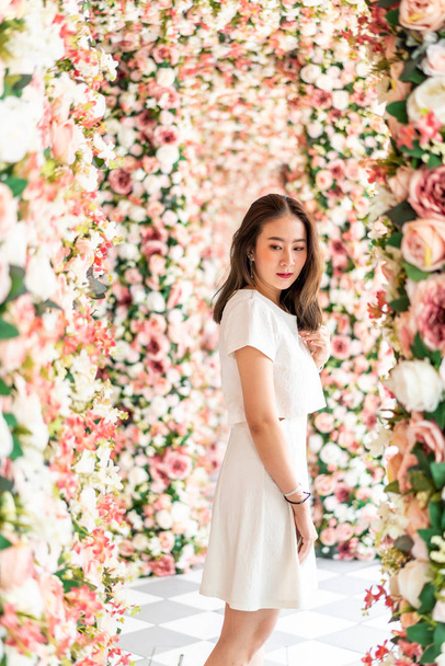 beautiful Asian woman with flower arches - valentine concept - 写真・画像
