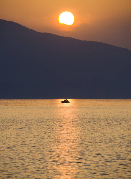 Waves and beautiful sunset on the Greek island Evia (Euboea) in the Aegean Sea - Fotó, kép