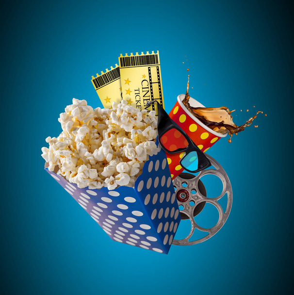 Pop-corn, movie tickets, clapperboard and other things in motion. - Фото, изображение