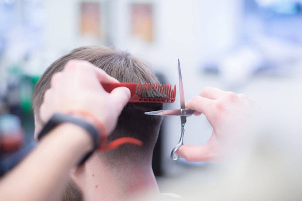 Professional hairstyle in barbershop. Men's hair care. - Foto, Imagem