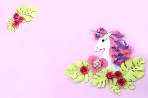 Colorful unicorn and flowers made of paper. Unicorn - symbol of magic, fulfillment of dreams. Paper art and paper craft. Invitation or holiday card for Valentine's Day, birthday and other holidays - Photo, image