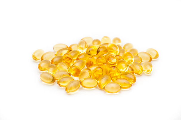 Close up of food supplement oil filled capsules suitable for: fish oil, omega 3, omega 6, omega 9, evening primrose, borage oil, flax seeds oil, vitamin A, vitamin D, vitamin D3, vitamin E. - Fotó, kép