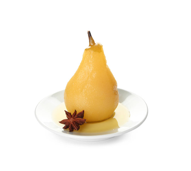 Plate with delicious poached pear in wine on white background - Фото, зображення