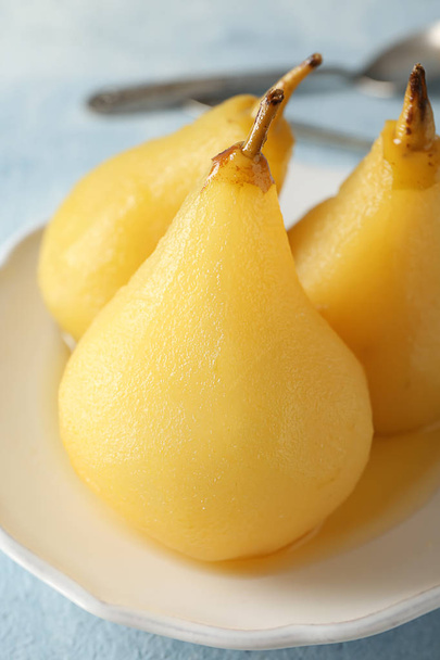 Delicious poached pears in wine on plate, closeup - Photo, image