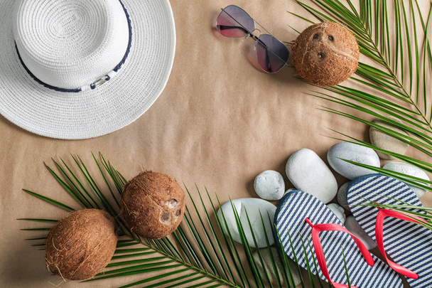 Composition with coconuts and beach accessories on color background - Photo, Image