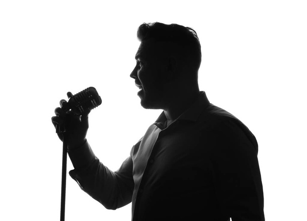 Silhouette di cantante maschile su sfondo bianco
 - Foto, immagini