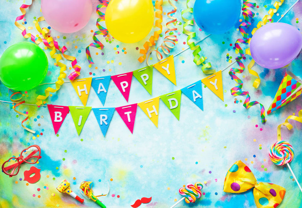 Party frame with balloons, streamers and confetti on colorful background with copy space and text Happy Birthday - Foto, Bild