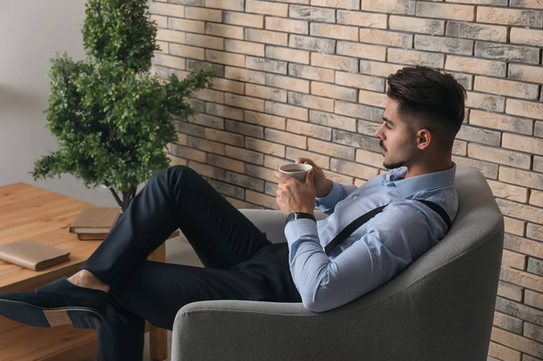 Stylish handsome man drinking coffee at home - Photo, Image