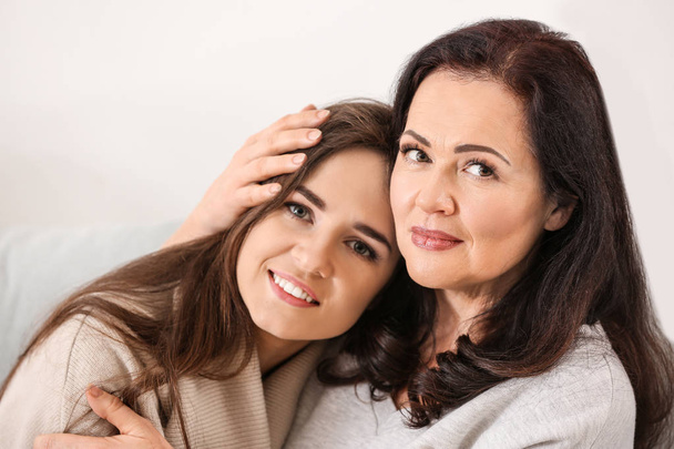 Portrait of young woman with her mother at home - Foto, Imagem