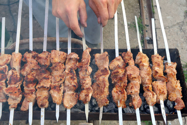 Meat on skewers skewers are cooked on charcoal - Photo, Image