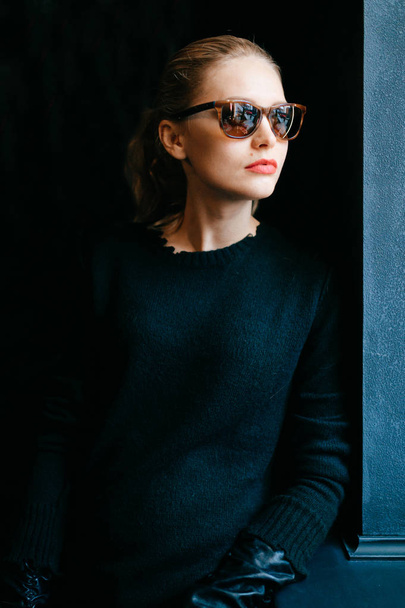 portrait of pensive elegant woman on dark background - Fotografie, Obrázek