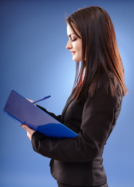 Profile pose of a young businesswoman - Photo, image