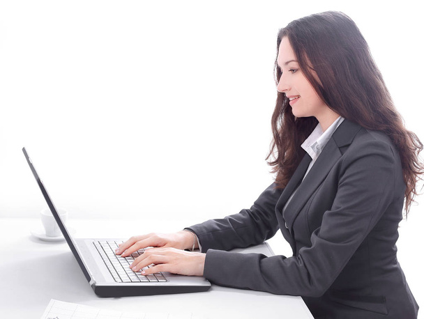 side view.business woman typing on a laptop. - Zdjęcie, obraz
