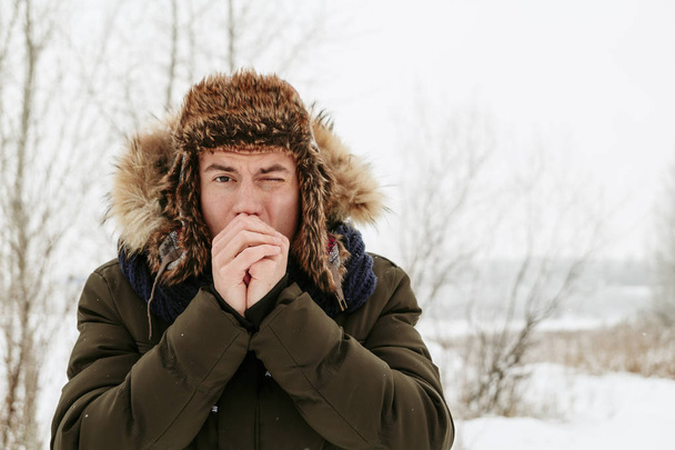 Winter portraits of a guy. Walk in nature - Zdjęcie, obraz