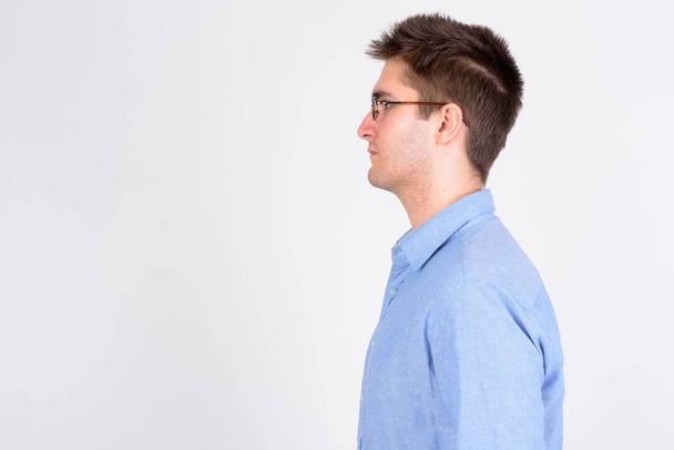 Profile view of young handsome businessman with eyeglasses - Φωτογραφία, εικόνα