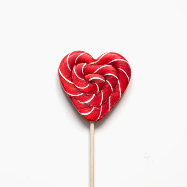 Valentine's card. Lollipops candy as heart on white background. Funny concept. - Fotografie, Obrázek