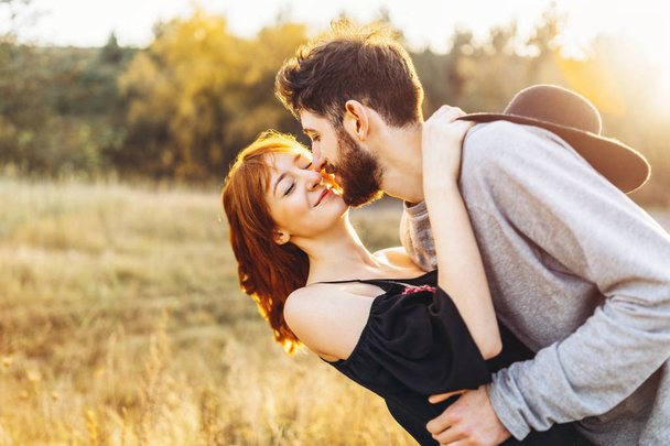 Pretty young romantic couple spend time together outdoor - Fotoğraf, Görsel