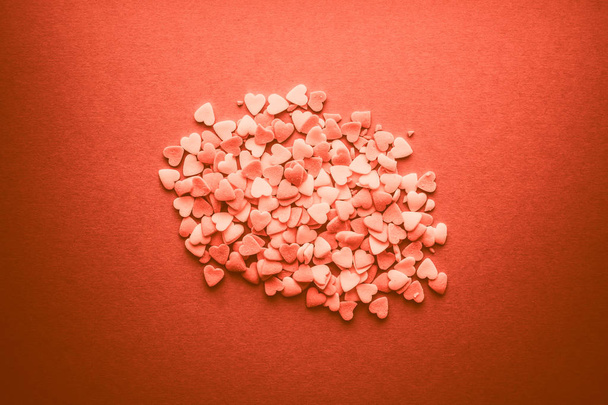 Hearts for Valentine's Day flat background in living coral pantone color - Fotografie, Obrázek