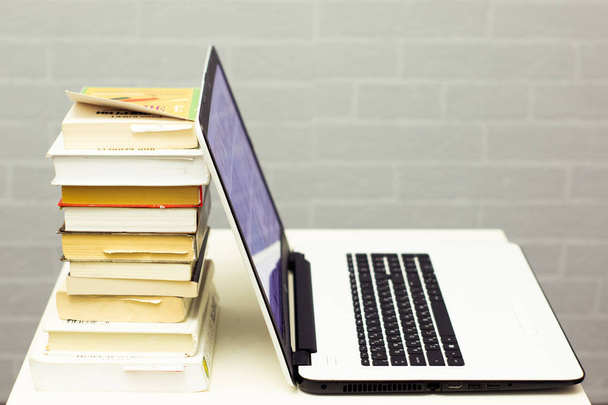 Education background with laptop and books - Φωτογραφία, εικόνα