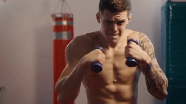 free fighter practicing shots in gym, slow motion - Felvétel, videó