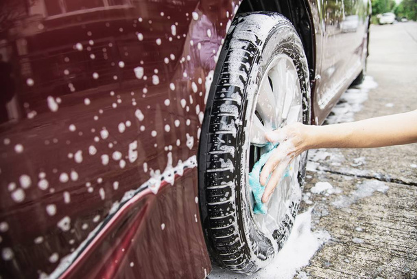Man wash car using shampoo - every day life car care concept - Foto, Imagem