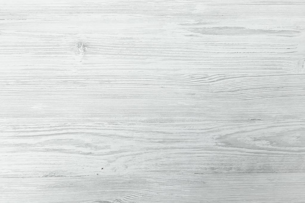 gewassen houten textuur achtergrond, lichte zachte eik van verweerde noodlijdende wash hout met vervaagde vernis verf tonen woodgrain textuur. witte hardhouten planken patroon tabel bovenaanzicht - Foto, afbeelding