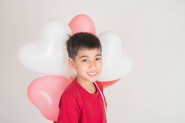 Boy  sibling with balloon  heart shape of love - Photo, Image