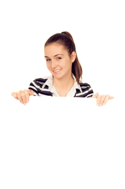 Chica sonriente sosteniendo una pizarra blanca en blanco
 - Foto, Imagen