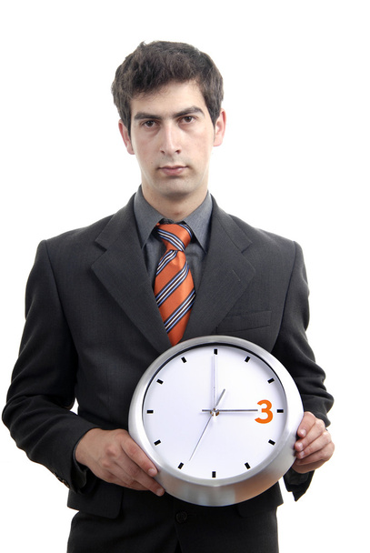 Joven hombre de negocios guapo sosteniendo un reloj
 - Foto, imagen