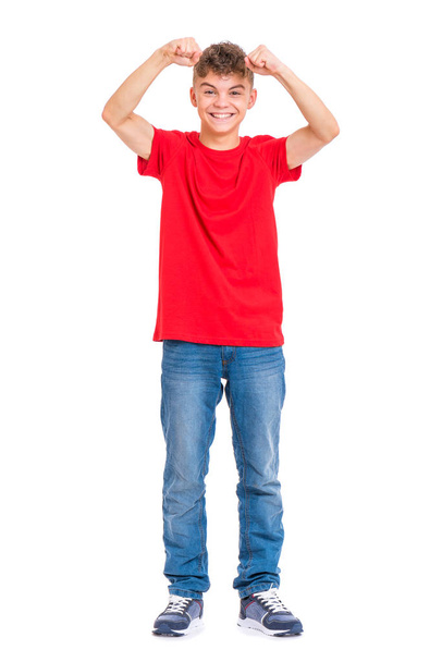 Full length portrait of young caucasian teen boy isolated on white background. Victory screaming funny teenager. Handsome winner child with his hands up looking at camera. - Foto, Imagen