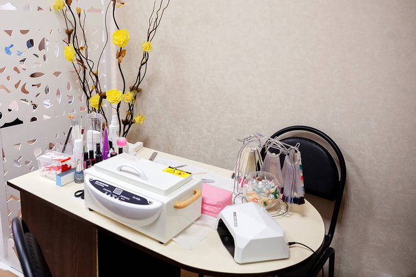 Manicure room. Workplace wizard. Nail and hand care. - Photo, Image