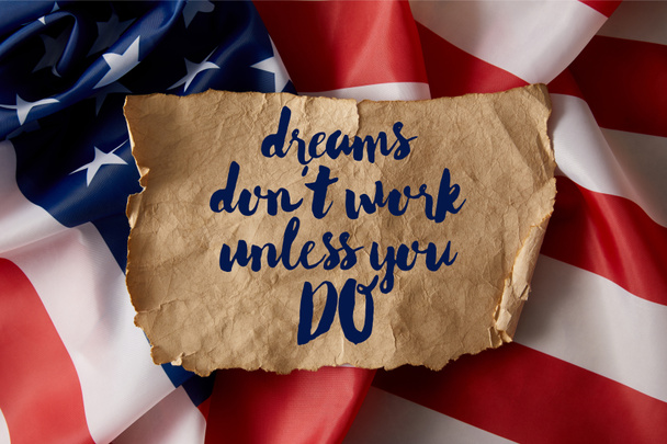 vintage crumpled paper with dreams dont work unless you do quote on american flag  - Fotografie, Obrázek