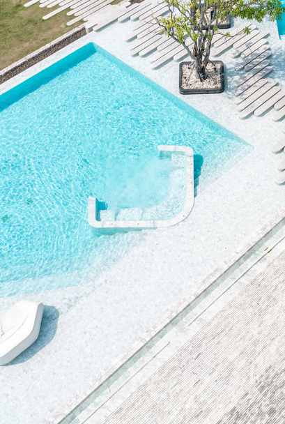Aerial view of Beautiful luxury hotel swimming pool resort with walk way - Fotó, kép