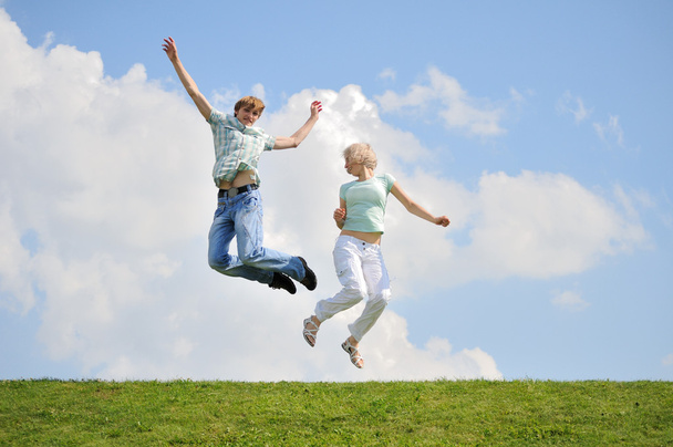 Pretty young couple is jumping - Photo, Image