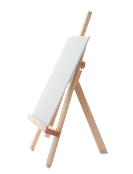 Wooden easel with blank canvas board on white background. Children's painting - Photo, image