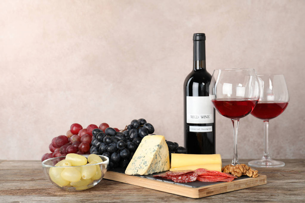 Composition with wine and snacks on table. Space for text - Foto, Imagem