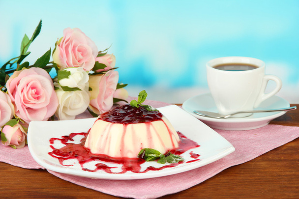 Panna Cotta with raspberry sauce, on bright background - Zdjęcie, obraz