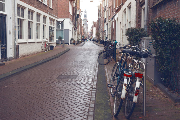 retro bike standing on a street of amsterdam, netherland - Foto, Bild