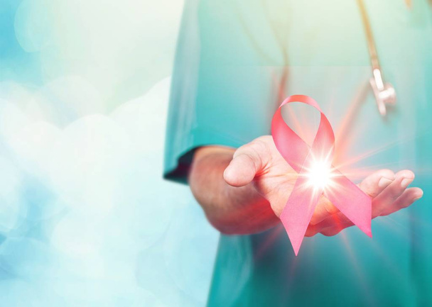 Doctor Hands Holding Pink Cancer Awareness Ribbon - Foto, Imagem