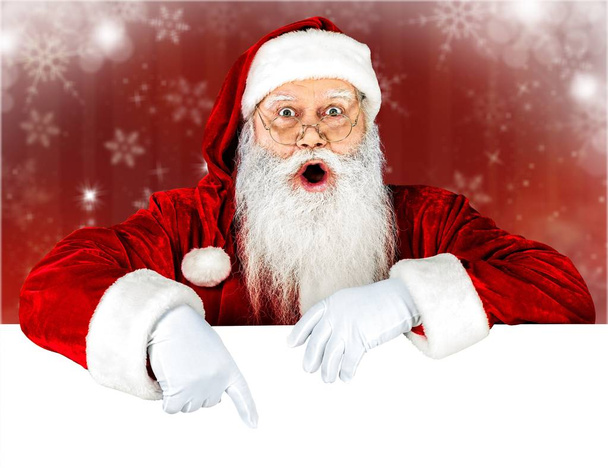 Portrait of santa claus with blank card isolated on white background  - Φωτογραφία, εικόνα