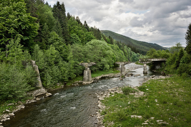 Ruined bridge over the Prut River in the Ukrainian Carpathians - Photo, Image