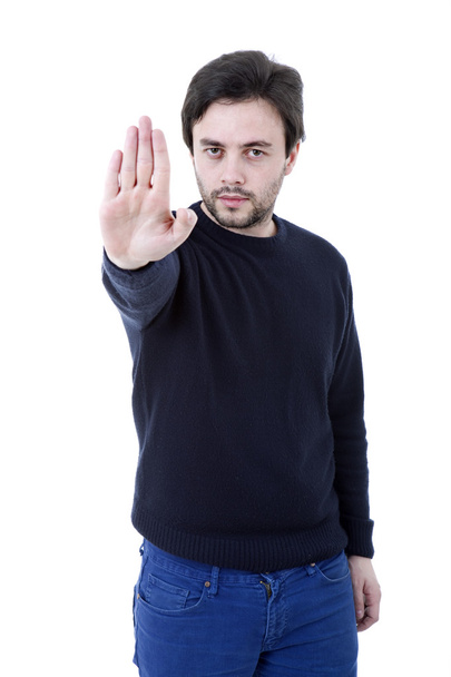 jonge man maken stop met zijn hand - Foto, afbeelding