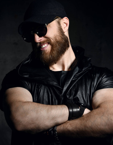 Brutal business man with beard and mustache in sunglasses and cap wear jacket  - Foto, afbeelding
