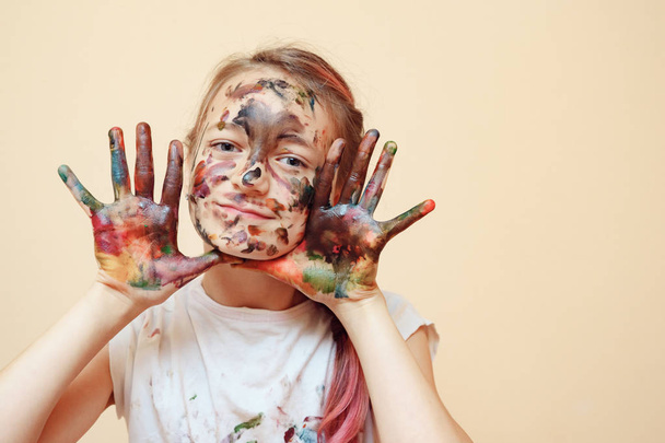 Playful boy being messy with colorful paints - Zdjęcie, obraz