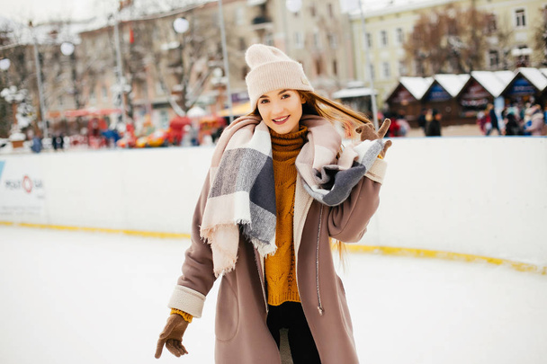 Cute and beautiful girl in a winter city - 写真・画像